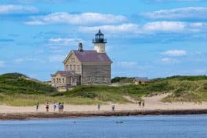 People can walk across the beach at the end of Corn Neck Road from New Shoreham to visit the light house.