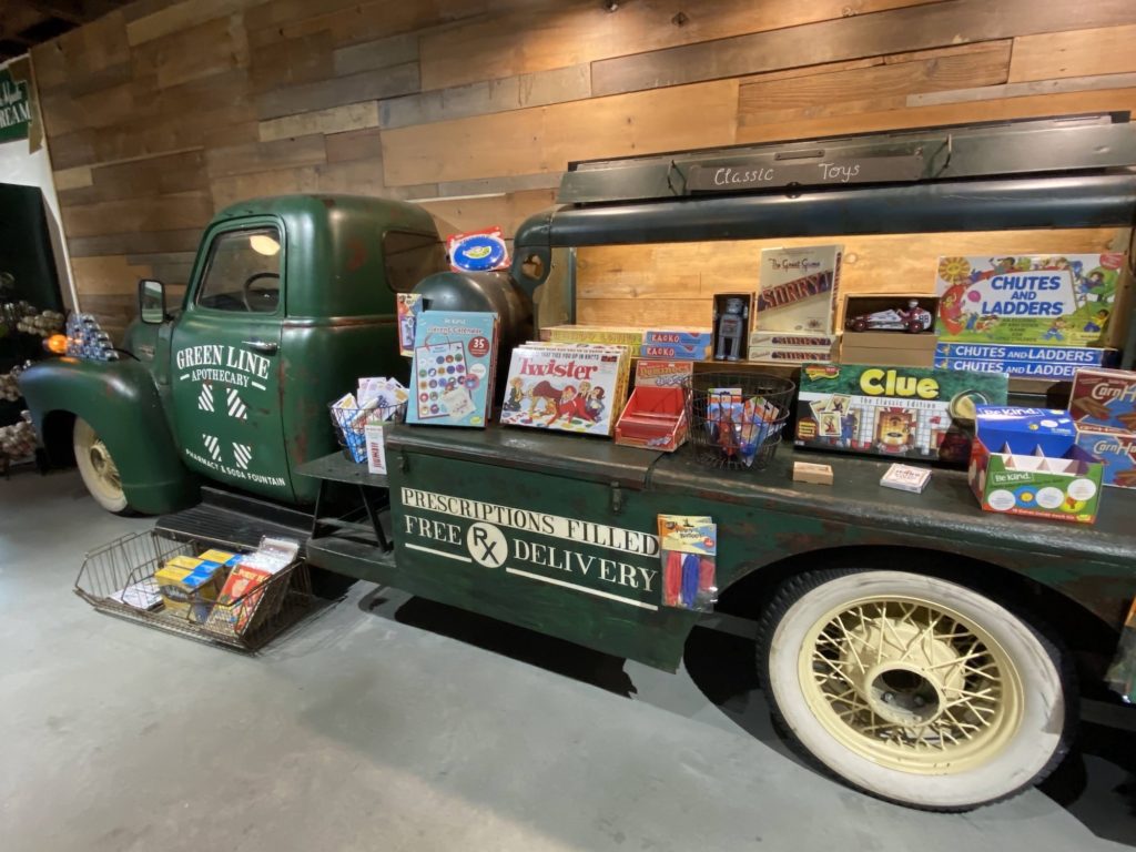 An amazing display of Hasbro games on the antique truck at Green Line Pharmacy.