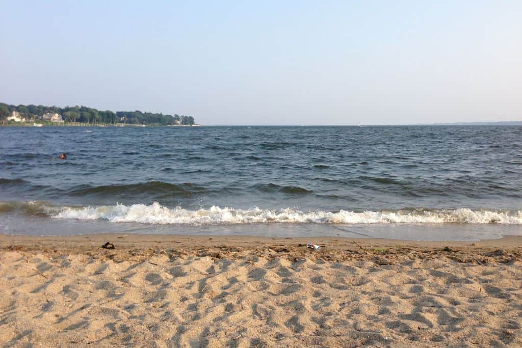 Oakland Beach is one of the most popular beaches for families without going to South County and worth visiting in Rhode Island.