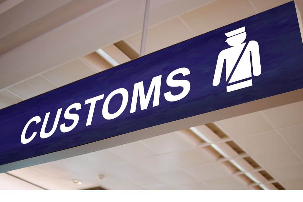 The dark blue Customs sign.