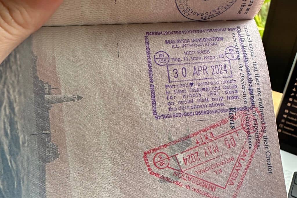 The passport stamps inside the passport received at Kuala Lumpur International Airport