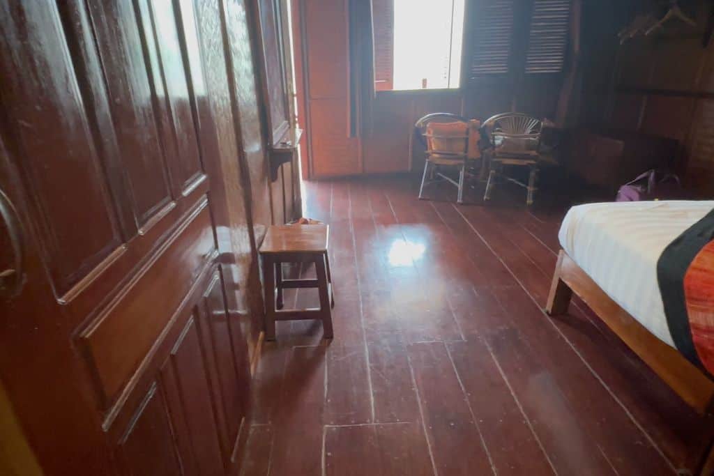 The dark paneled room of the Mekong Riverside Lodge