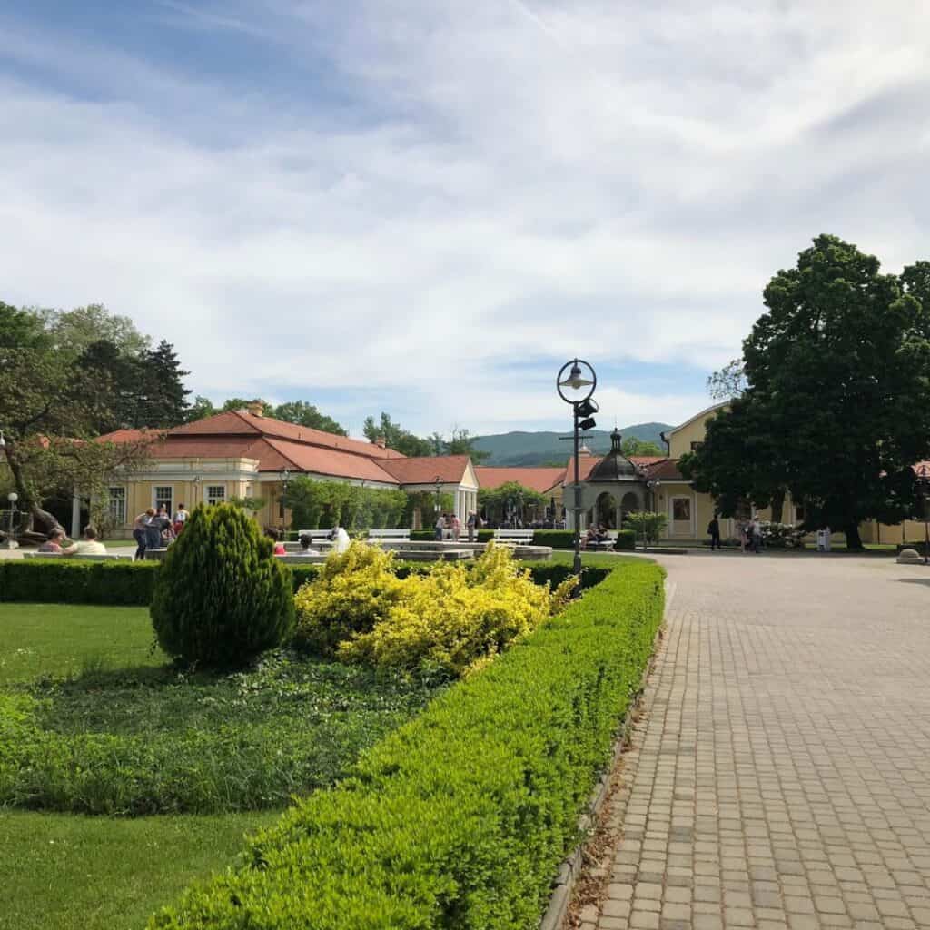 The brick walkway at Spa Irma in Piestany with beautiful grass and shrubbery.