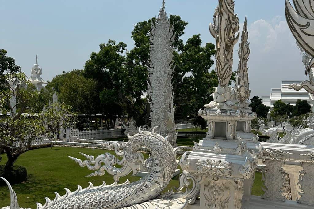 Scenery of the White Temple and showing a fierce dragon statue.