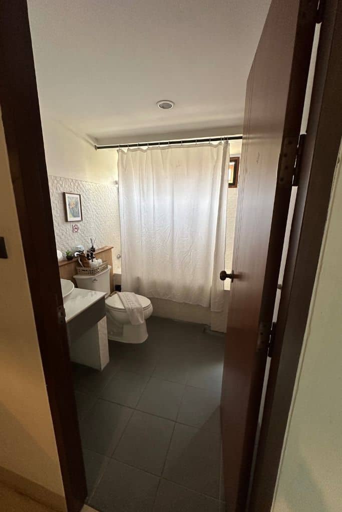 The bathroom at the Old City Wall Inn showing the toilet and tub.