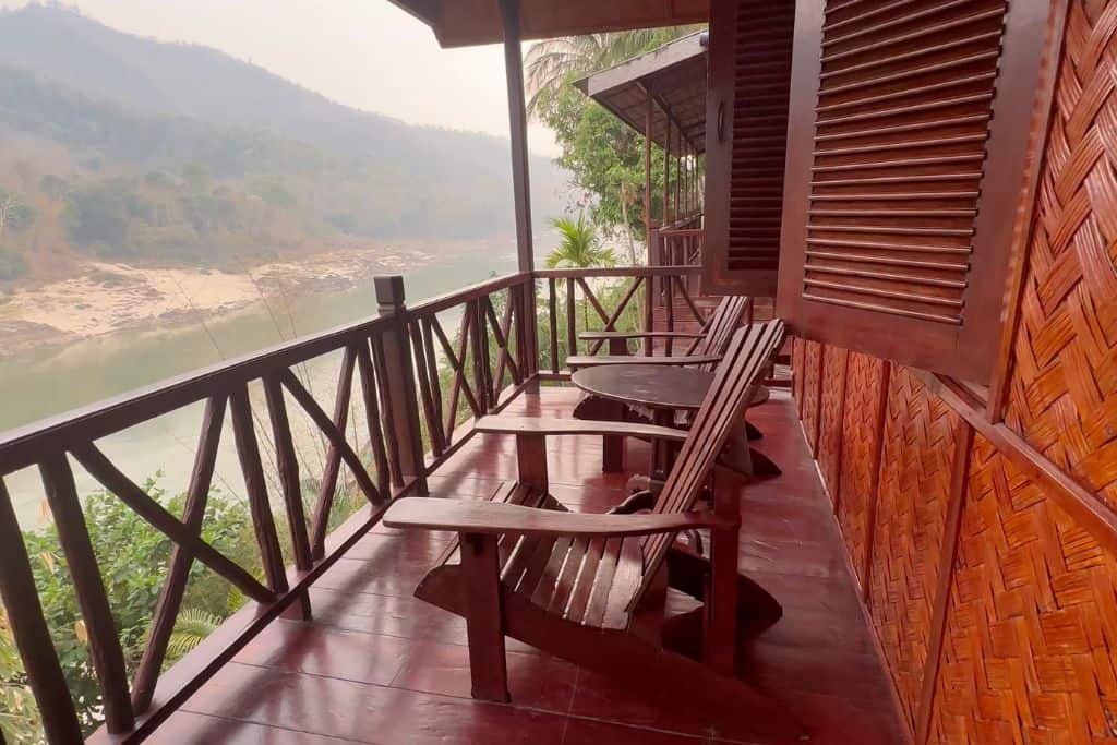 The redwood deck and adirondack chairs on the deck overlooking the Mekong River.