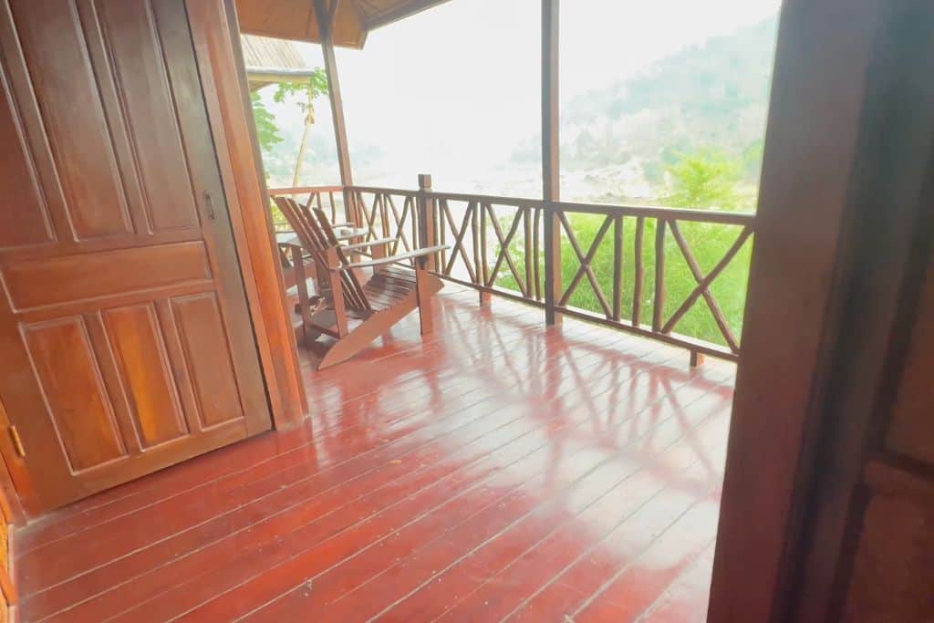 The redwood deck overlooking the Mekong River down below