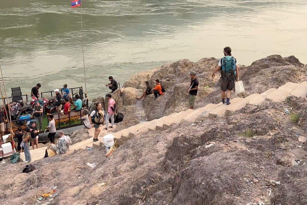 The steep uneven concrete steps with no railings leading up to the landing area from the slowboat on the river