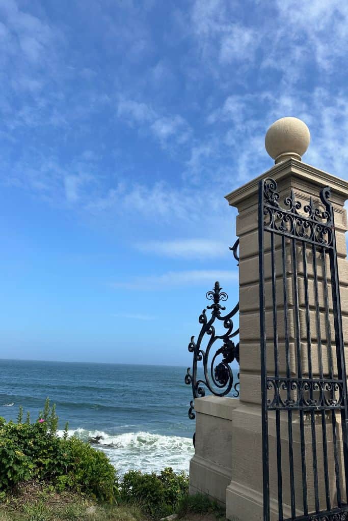 Stone gate at the entrance to the Cliff Walk from the back lawn of the Breakers in Newport