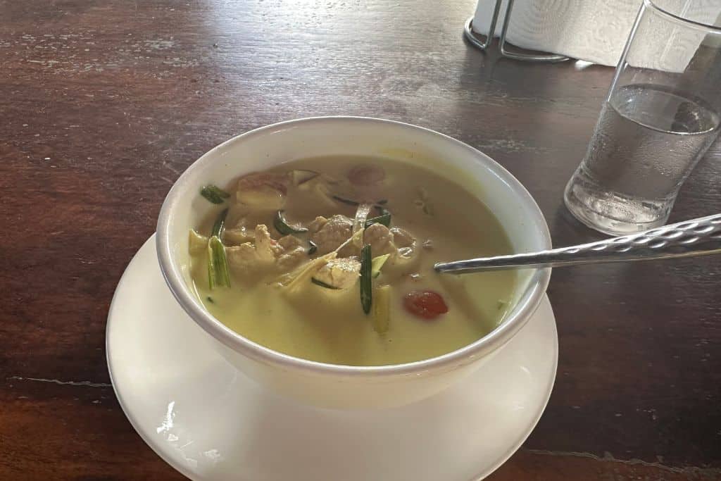 A steaming bowl of Tom Kha soup sitting on the table ready for me to taste.