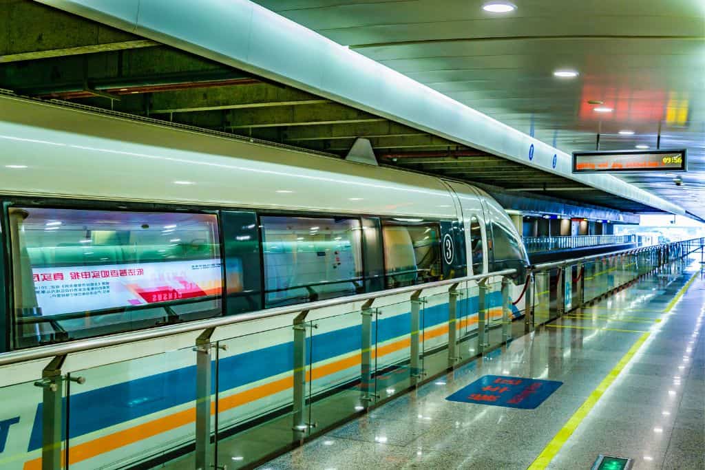 A sleek modern looking train at the station in China.